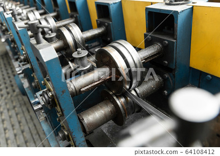Detail of stainless steel pipe bending machine. Close up. Detail of stainless steel pipe bending machine. Close up. 64108412