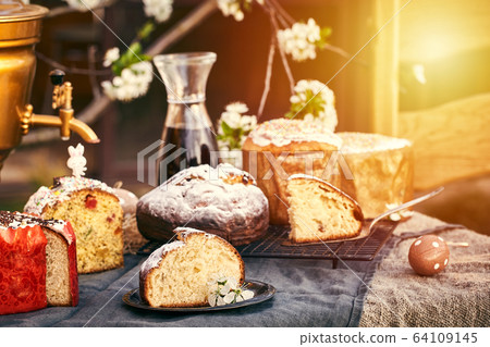 Traditional russian Easter cottage cheese dessert. Orthodox paskha, kulich cakes on table. Traditional russian Easter cottage cheese dessert. Orthodox paskha, kulich cakes on table. 64109145