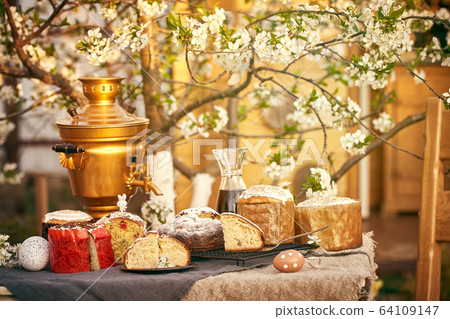 Traditional russian Easter cottage cheese dessert. Orthodox paskha, kulich cakes on table. Traditional russian Easter cottage cheese dessert. Orthodox paskha, kulich cakes on table. 64109147