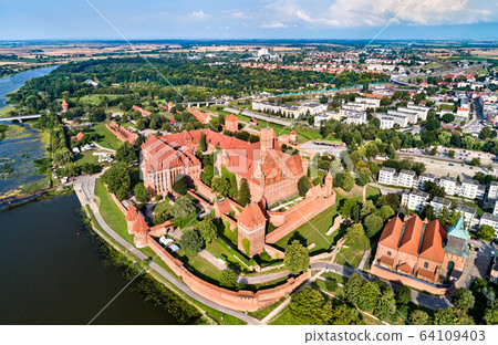Malbork Castle on the bank of the Nogat River. UNESCO world heritage in Poland 64109403