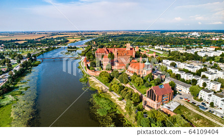Malbork Castle on the bank of the Nogat River. UNESCO world heritage in Poland 64109404