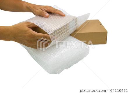 hand of man hold bubble wrap, for protection parcel product cracked or insurance During transit isolated and white background 64110421