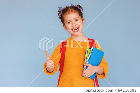 Cheerful girl approving school education. 64110592