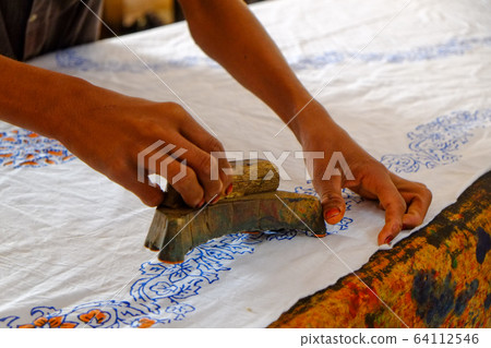 A place where craftsmen are patterning wood with a woodblock at a block print workshop in Rajasthan, India 64112546