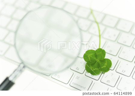 Four leaf clover, keyboard and magnifying glass Four leaf clover, keyboard and magnifying glass 64114899