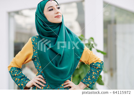 Proud muslim young woman 64115972