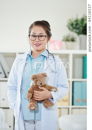 Smiling experienced pediatrician Smiling experienced pediatrician 64116537