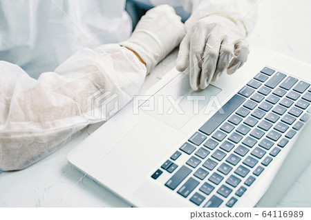 Bio hazard man with laptop. 64116989