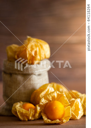 Cape gooseberry in burlap bags. Concept of health care or herb. Closeup and copy space for text. 64118264