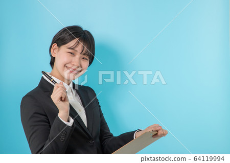 Business woman writing in materials 64119994
