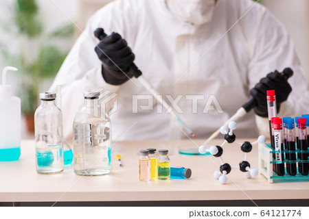 Doctor working in lab in coronavirus COVID-19 concept 64121774