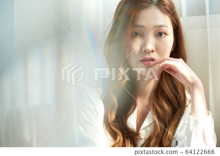 Young woman window sunshine beauty skin whitening 64122666