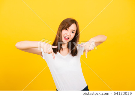 woman teen standing makes gesture two fingers 64123039