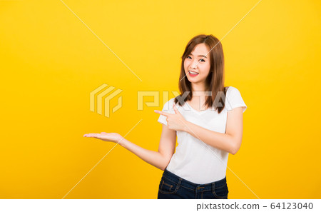 woman teen standing holding something on palm and 64123040