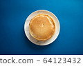 Fresh pancakes on a white dish. Classic blue 64123432