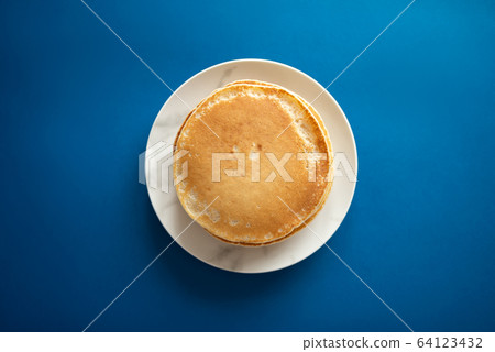 Fresh pancakes on a white dish. Classic blue 64123432