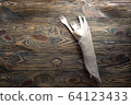 Wooden disposable forks and knives in linen napkin 64123433