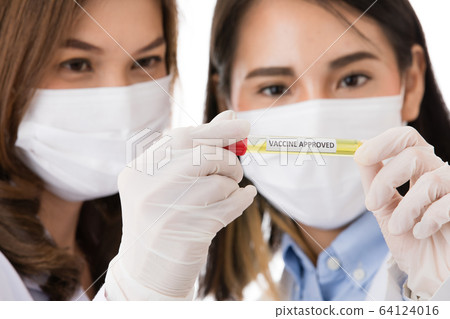 Two researchers looking to test tube. 64124016