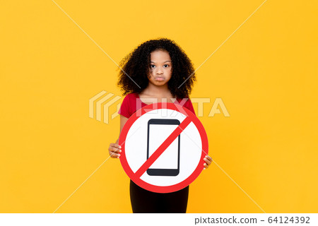 Mixed race African girl showing no mobile phone sign 64124392