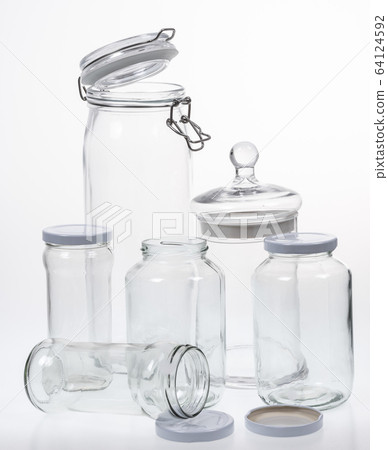 Collection of empty jars on white background with clipping pat 64124592