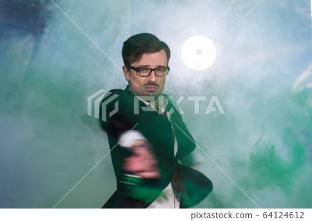 Pasadoble, latin solo dance and contemporary dance - Handsome male dancing into smoke cloud. 64124612