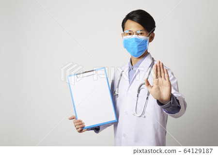 attractive asia man doctor showing stop gesture attractive asia man doctor showing stop gesture 64129187