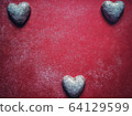 Red dusty background with heart shaped sweet biscuits and text space for valentine's day 64129599