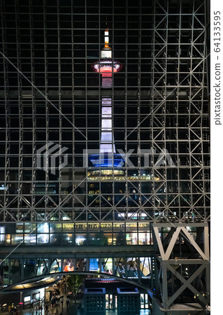 Kyoto Tower at night lit up 64133595