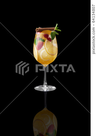 Tasty cocktail on dark background Tasty cocktail on dark background 64134807