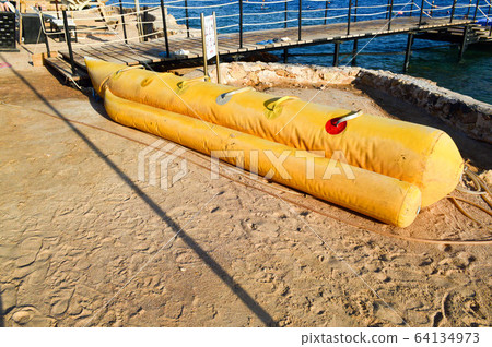 Inflatable yellow boat in the form of a banana Inflatable yellow boat in the form of a banana 64134973