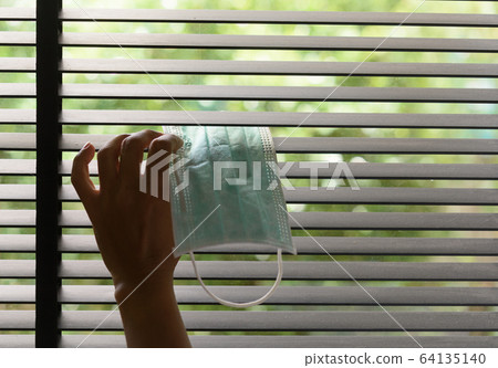 Watch the nature through the blinds. Peep through 64135140