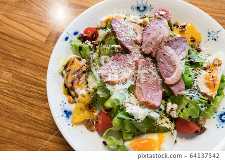 Duck breast salad, including vegetables, fruits, eggs. Duck breast salad, including vegetables, fruits, eggs. 64137542