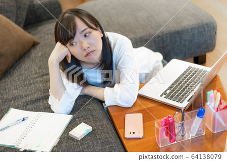 Young woman tired of work Young woman tired of work 64138079