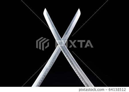 Crossed blades of two katanas 64138512