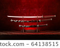 Three swords on stand, katana blade exposed, red 64138515
