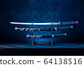 Three swords on stand, katana blade exposed, blue 64138516