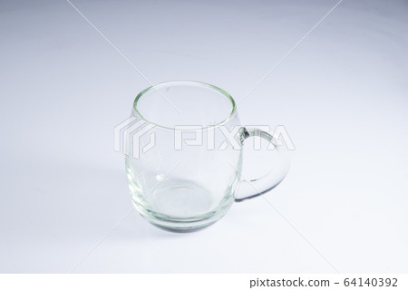 transparent mug on white acrylic sheet transparent mug on white acrylic sheet 64140392