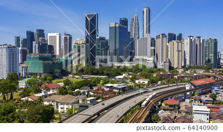 Kuala lumpur city skyline with blue sky 64140900