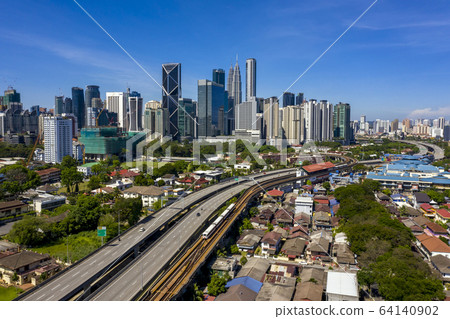 Kuala lumpur city skyline with blue sky Kuala lumpur city skyline with blue sky 64140902