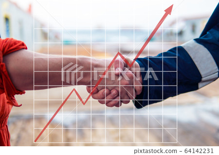 Concept of growth up in marine industry with rising graphics. marine contractor businessman handshaking with worker Concept of growth up in marine industry with rising graphics. marine contractor businessman handshaking with worker 64142231