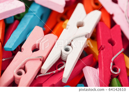 Colorful Wooden clothespins close-up as texture and background. Colorful Wooden clothespins close-up as texture and background. 64142610