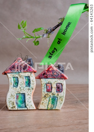 The inscription stay home, ceramic houses and a 64143263
