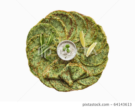 Isolated spinach Adai - Indian green pancakes Isolated spinach Adai - Indian green pancakes 64143613