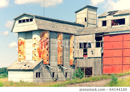Grain processing plant left in the village Grain processing plant left in the village 64144189