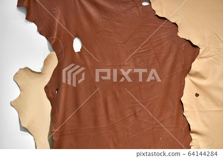 Top view at brown and beige large pieces of leather Top view at brown and beige large pieces of leather 64144284