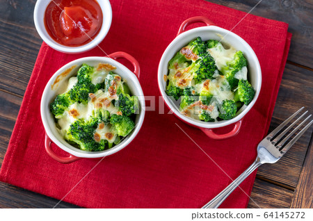 Baked broccoli with cheese Baked broccoli with cheese 64145272