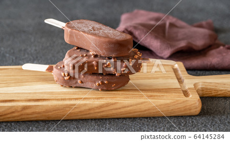 Chocolate-covered vanilla ice cream bars Chocolate-covered vanilla ice cream bars 64145284