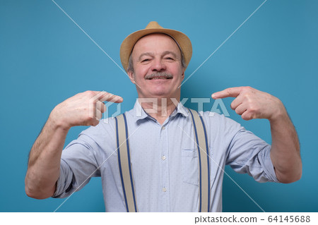 Senior proud man pointing finger himself. Richly and success concept. 64145688