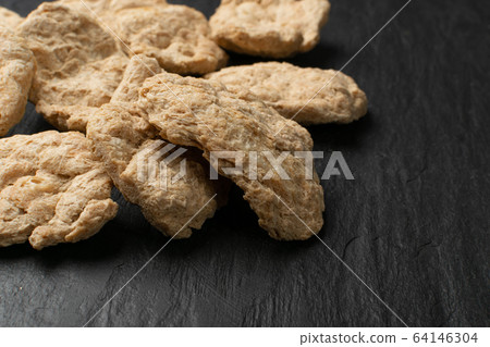 Raw Dehydrated Soy Meat or Soya Chunks on Black Raw Dehydrated Soy Meat or Soya Chunks on Black 64146304