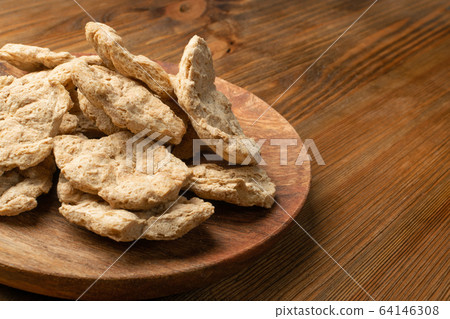 Raw Dehydrated Soy Meat or Soya Chunks on Wood Raw Dehydrated Soy Meat or Soya Chunks on Wood 64146308